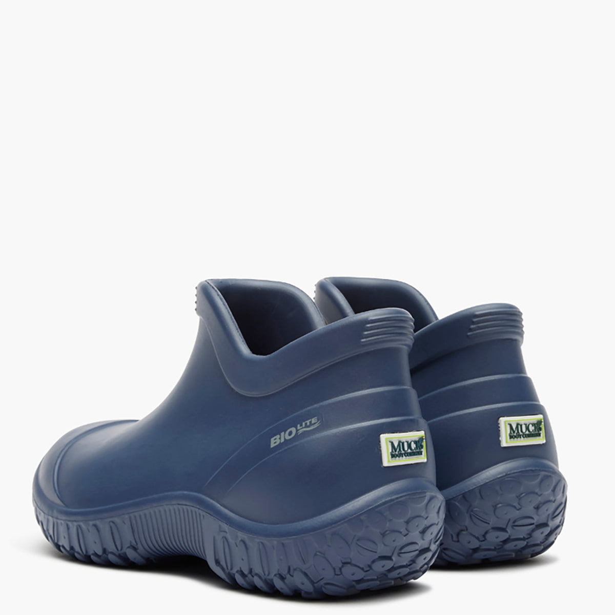 Pair of blue slip-on shoes with a visible brand logo on a white background