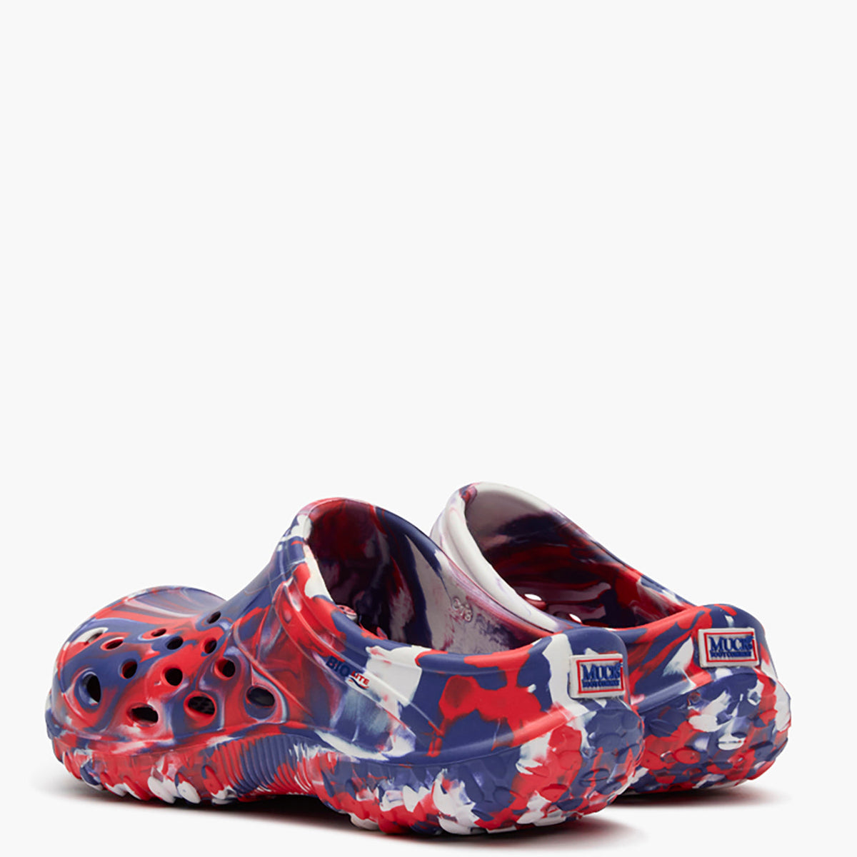 Colorful clogs with an american swirl pattern on a white background