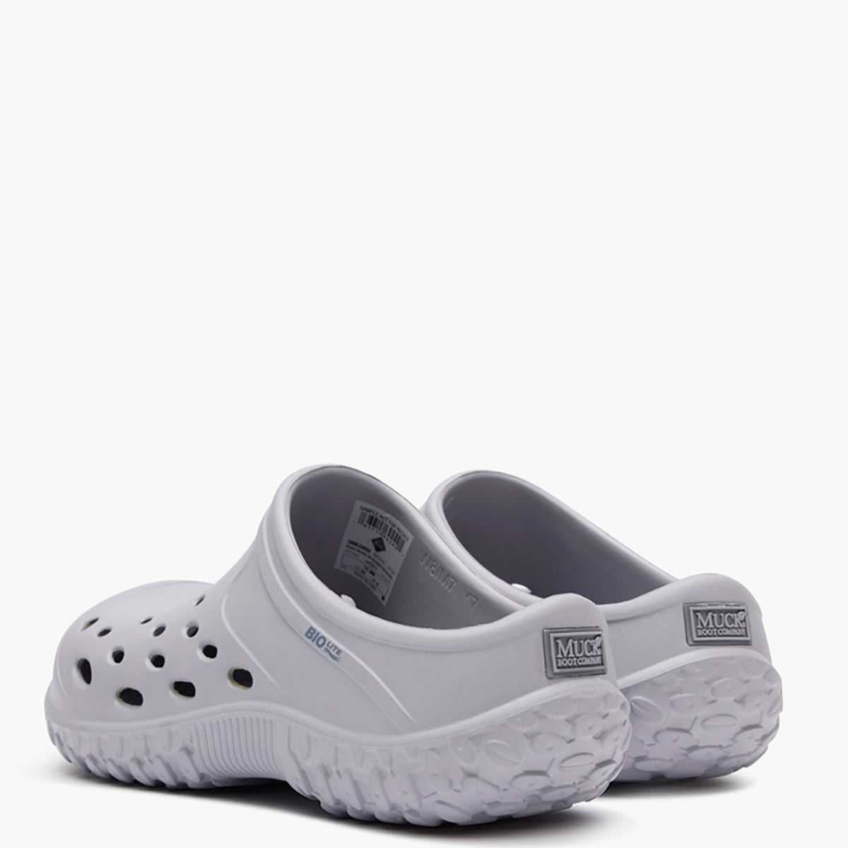 Pair of gray clogs on a white background