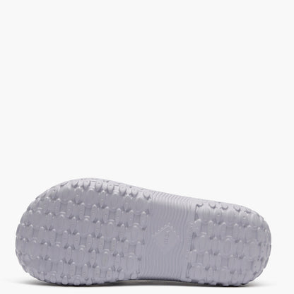 Gray sandal sole with textured pattern on a white background